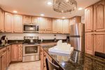 Grand kitchen equipped w/ cooking & dining essentials 